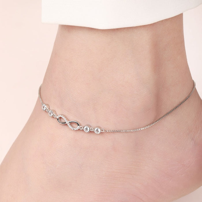 Sparkling infinity 925 Sterling Silver anklet on a woman's ankle. Silver jewelry for women – Zavya