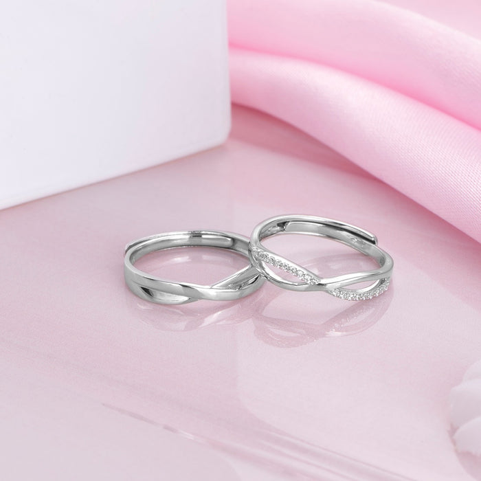 Adjustable 925 Sterling Silver infinity couple rings for women with crystals on a pink surface – Zavya