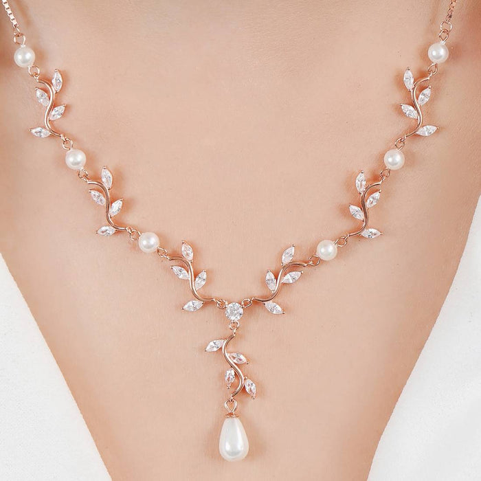Woman wearing a rose gold 925 Sterling Silver pendant necklace with CZ vine leaves and pearls – Zavya