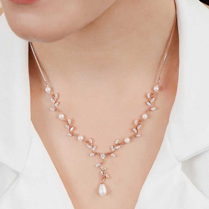 Woman wearing a rose gold 925 Sterling Silver pearl & CZ pendant necklace. Jewelry for women – Zavya