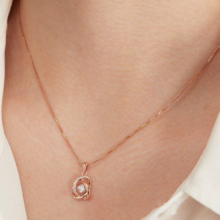 Woman wearing a rose gold 925 Sterling Silver necklace for women with a sparkling crystal pendant – Zavya