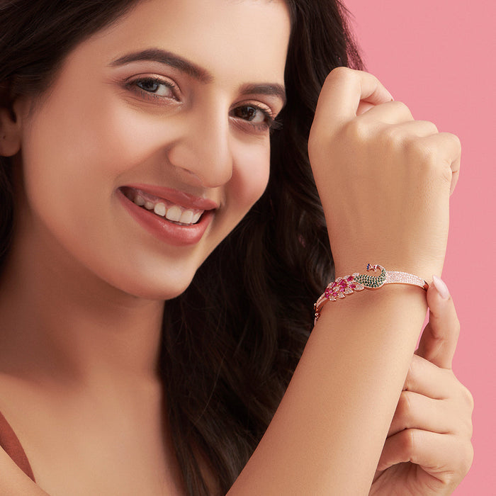 Close-up of smiling woman wearing a rose gold 925 Sterling Silver peacock bracelet. Women's jewellery – Zavya