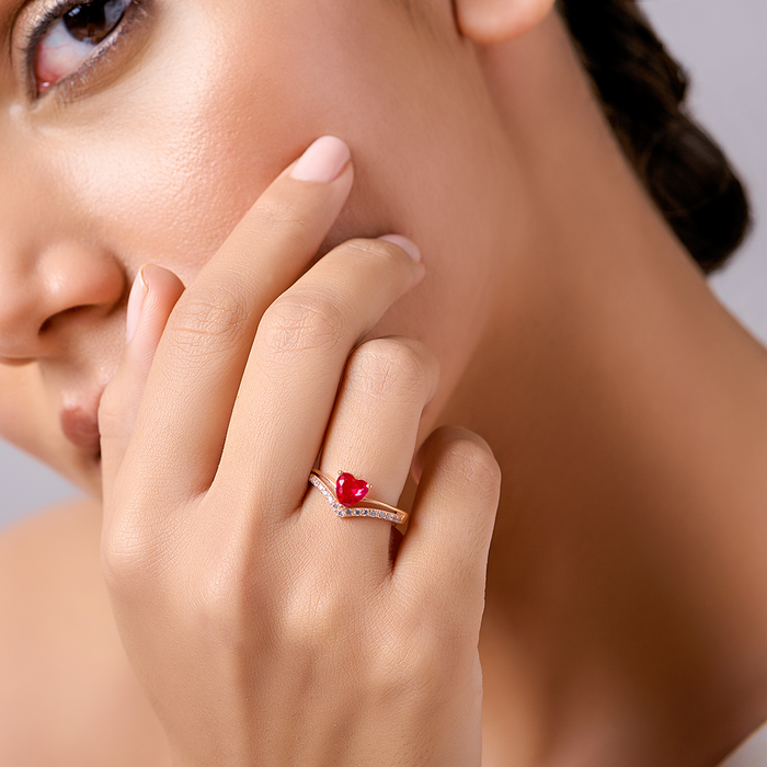 Woman touching face wearing a pink heart rose gold 925 Sterling Silver ring – Zavya