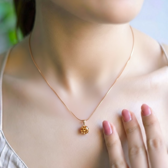 Woman wearing a gold plated 925 Sterling Silver solitaire pendant necklace with snake chain – Zavya