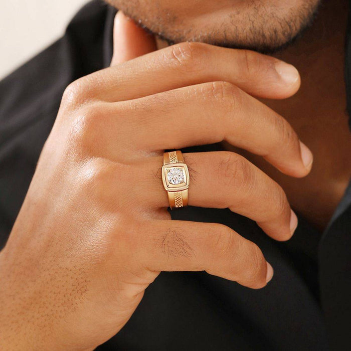 Man's hand wearing a gold-plated 925 Sterling Silver solitaire ring. Perfect jewellery gift for him. – Zavya