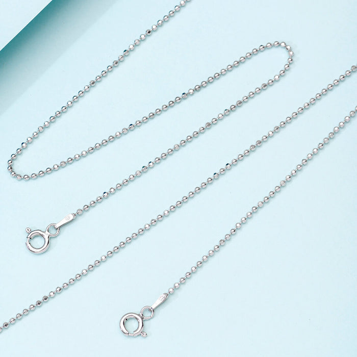 Minimal tiny beaded chain 925 Sterling Silver anklet for women on a light blue background – Zavya