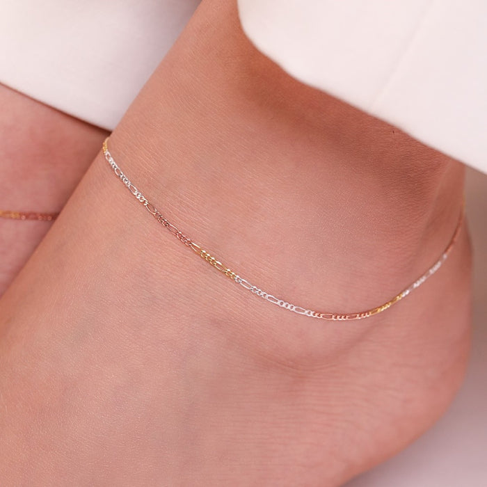 Minimal triple tone figaro chain 925 sterling silver anklet delicately worn on a woman's ankle. – Zavya