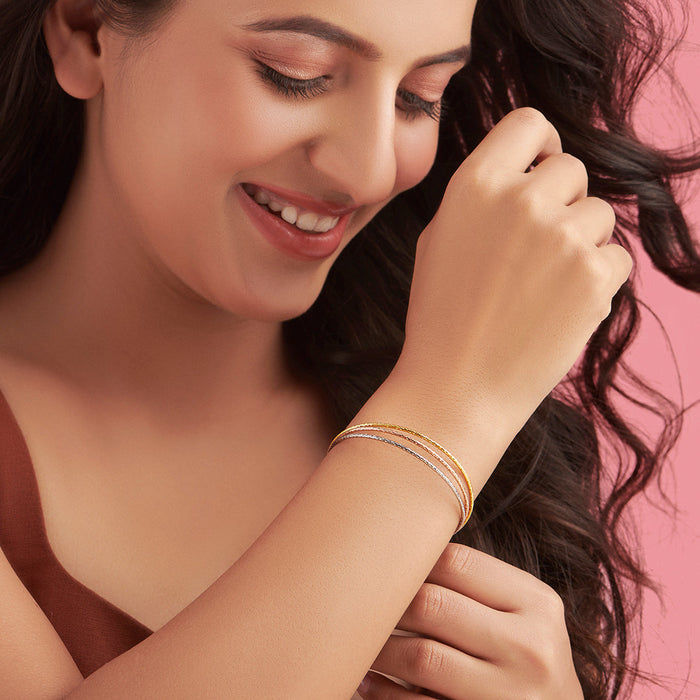 Smiling woman wearing a multi-strand 925 Sterling Silver bracelet. Elegant women's jewellery – Zavya