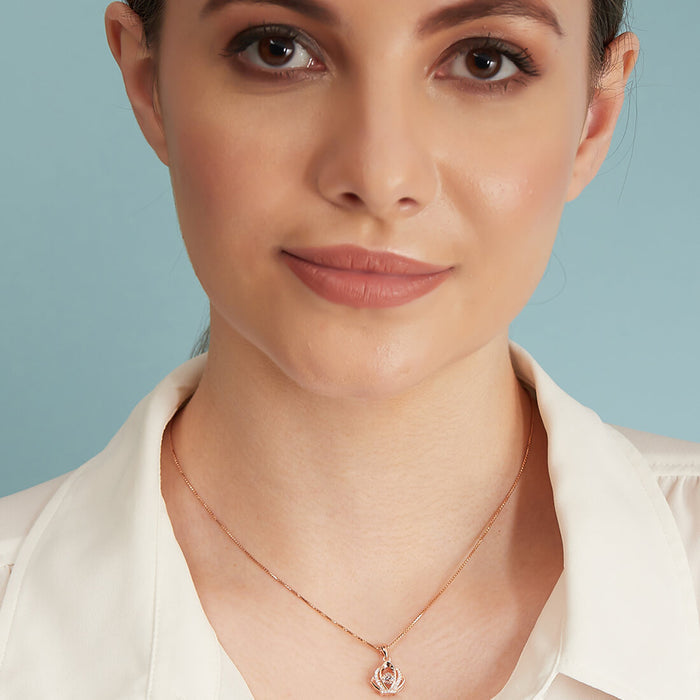 Woman wearing a 925 Sterling Silver necklace with rose gold crown pendant. Jewelry for women. – Zavya