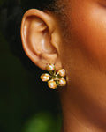 Ododo Ife floral motif stud earrings crafted with carved Mediterranean coral petals and gold centers by Jewellery Banc.