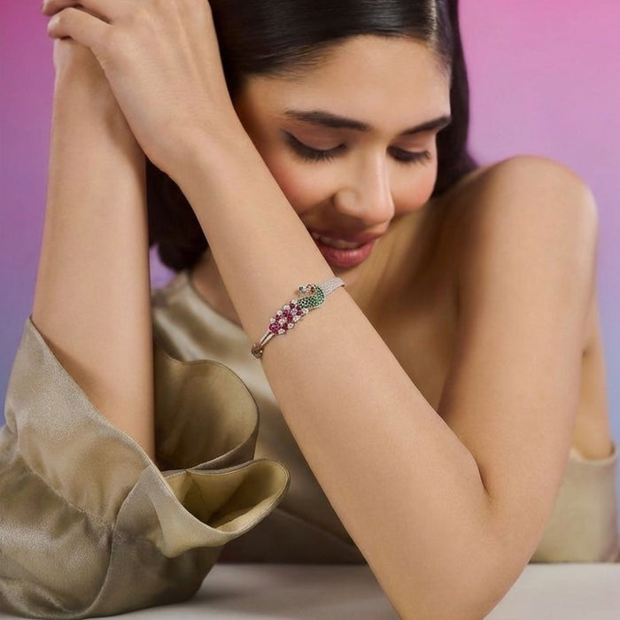 Smiling woman wearing a 925 Sterling Silver peacock cuff bracelet. Women's silver jewelry – Zavya