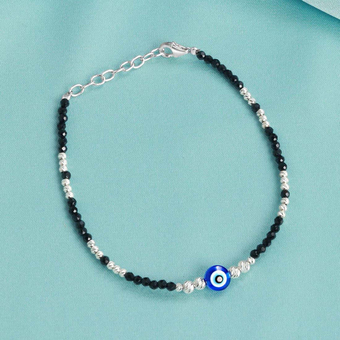 925 Sterling Silver evil eye bracelet for women with black beads and a blue protective charm. – Zavya
