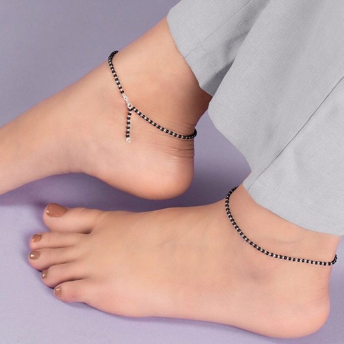 Woman wearing black bead 925 Sterling Silver anklets. Elegant everyday jewelry for women. – Zavya