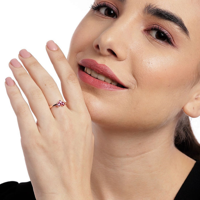 Smiling woman wearing a rose gold ruby heart 925 Sterling Silver ring. Fine jewellery for women – Zavya