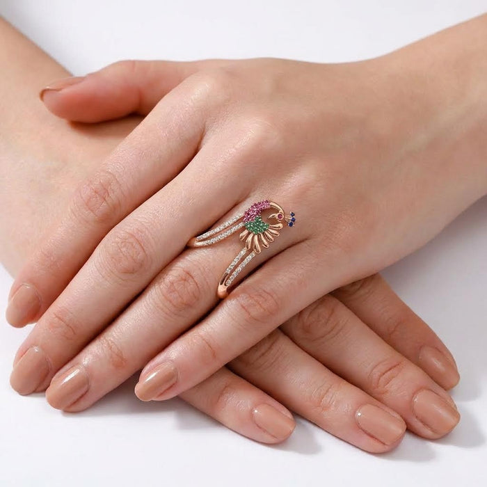 Woman wearing a rose gold peacock 925 Sterling Silver ring with colorful CZ. Women's jewellery – Zavya