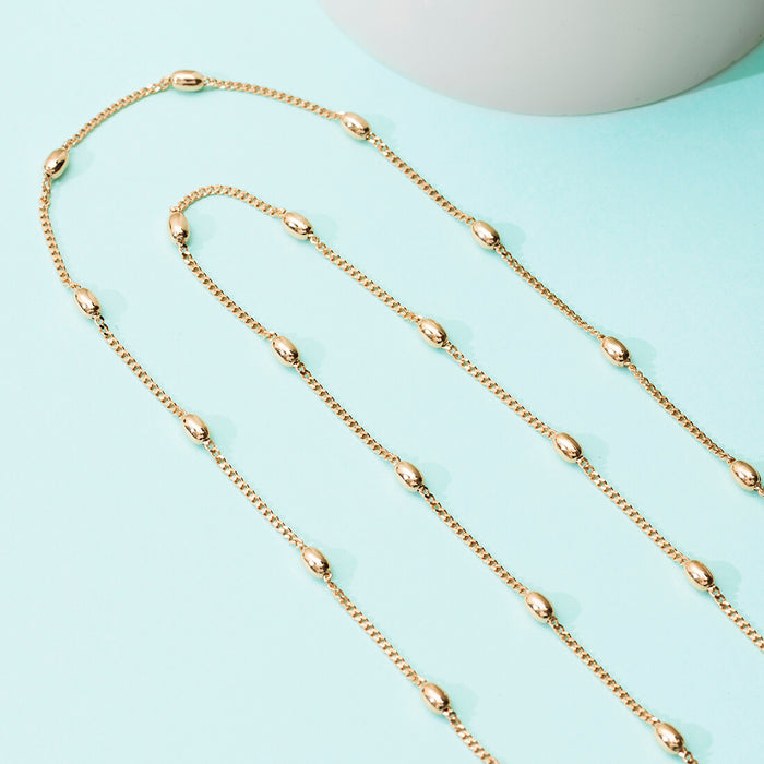 Rose gold beaded 925 Sterling Silver anklet chain for women. Fine jewellery on a blue background. – Zavya