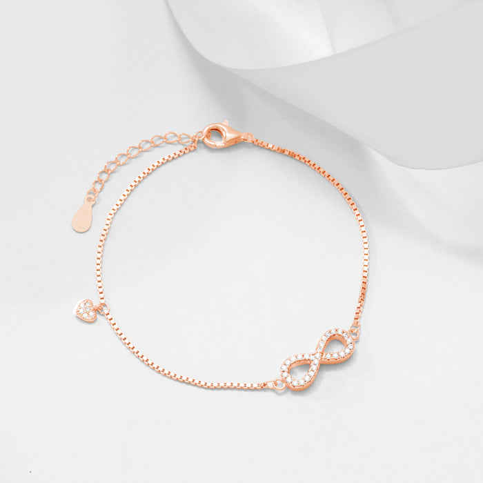 Rose gold 925 Sterling Silver minimal infinity bracelet for women with a studded heart charm. – Zavya