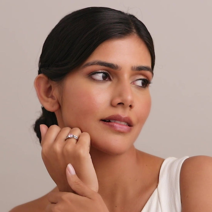Woman wearing a beautiful solitaire gemstone 925 Sterling Silver ring. Elegant women's jewellery. – Zavya
