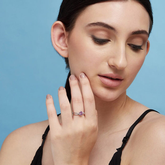 Woman modeling a pink solitaire 925 Sterling Silver ring. Elegant women's gemstone jewellery – Zavya
