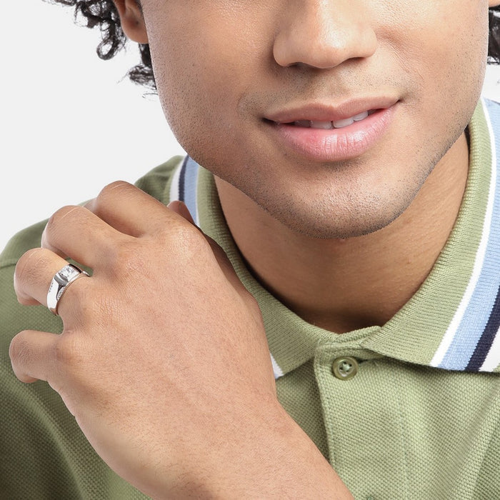 Smiling man wearing a 925 Sterling Silver solitaire ring. Perfect jewelry gift for him. – Zavya