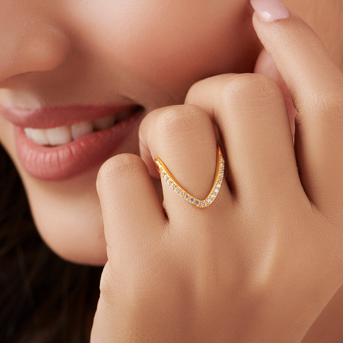 Smiling woman wearing a sparkling gold plated 925 Sterling Silver Vanki ring. Jewellery for women – Zavya