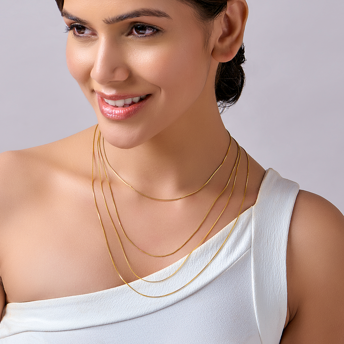 Woman wearing a layered gold plated 925 Sterling Silver box chain necklace. Modern women's jewelry – Zavya