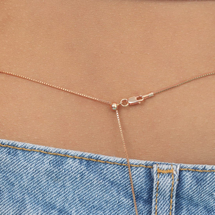 Rose gold 925 Sterling Silver women's waist chain. Close-up of sliding box chain clasp worn above blue jeans – Zavya