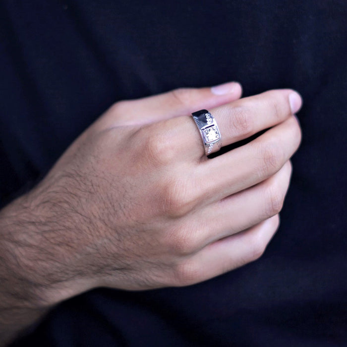 Man's hand wearing a CZ studded 925 Sterling Silver ring. A perfect jewellery gift for him – Zavya