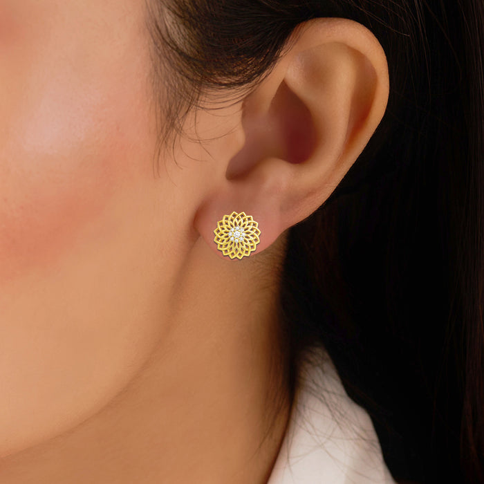 Close-up of woman wearing Sun-kissed Bloom gold plated 925 Sterling Silver floral stud earrings – Zavya