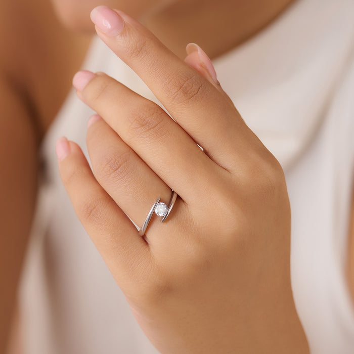 Woman's hand wearing a 925 Sterling Silver adjustable solitaire ring. Fine women's jewellery. – Zavya