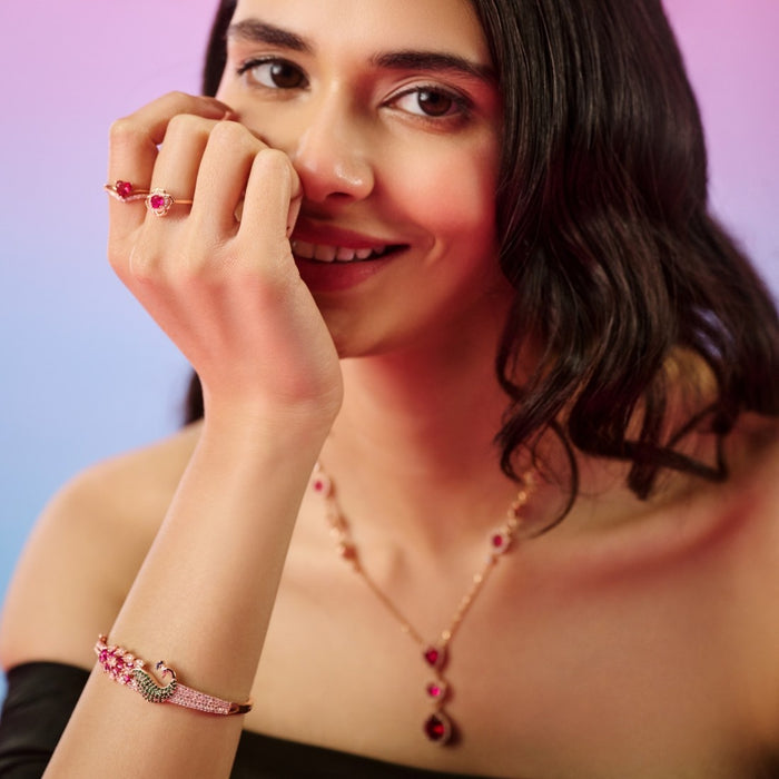 Smiling model touching face, wearing a Pink Heart Rose Gold Plated 925 Sterling Silver ring – Zavya