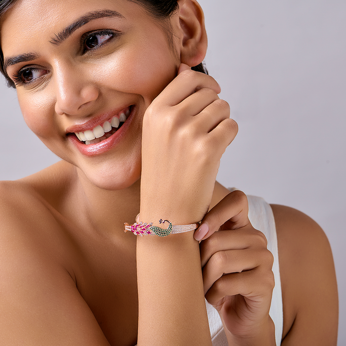 Close-up of woman wearing a rose gold peacock bracelet in 925 Sterling Silver. Fine women's jewellery – Zavya