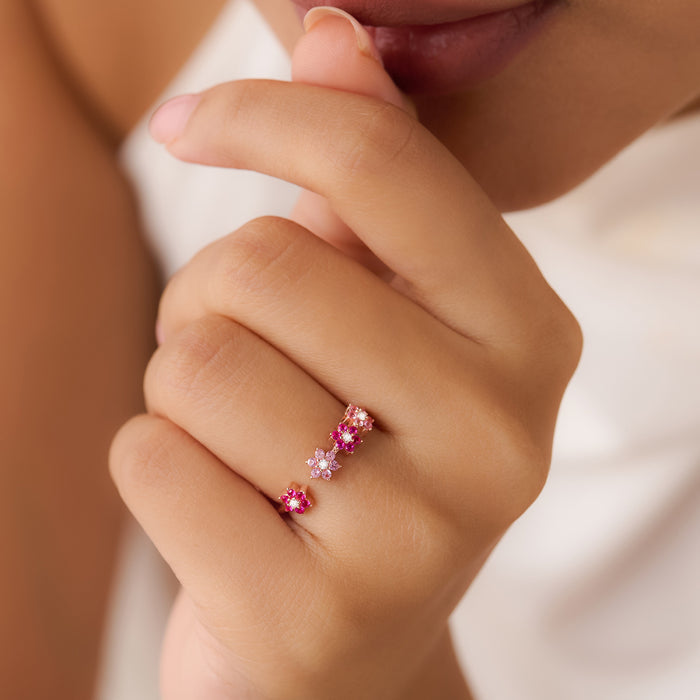Woman wearing a 925 Sterling Silver rose gold adjustable ring with pink flowers. Jewellery for women – Zavya