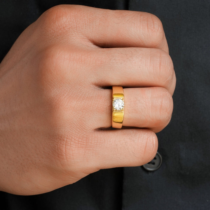 Man's hand wearing a gold-plated 925 Sterling Silver solitaire ring. Ideal gift for him – Zavya