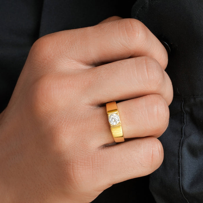 Man's hand wearing a gold plated 925 Sterling Silver solitaire ring. Perfect jewellery gift for him – Zavya
