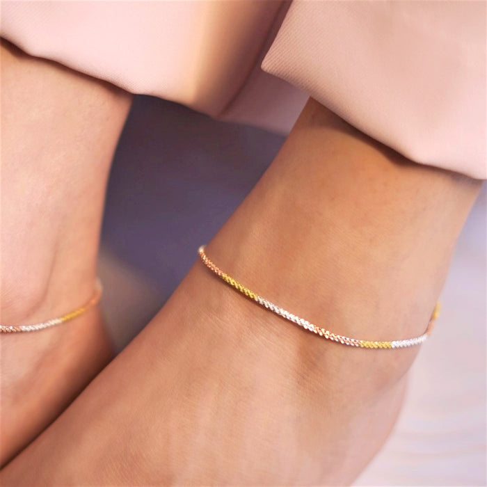 Woman wearing a triple tone weave 925 Sterling Silver anklet. Elegant silver jewellery for women – Zavya