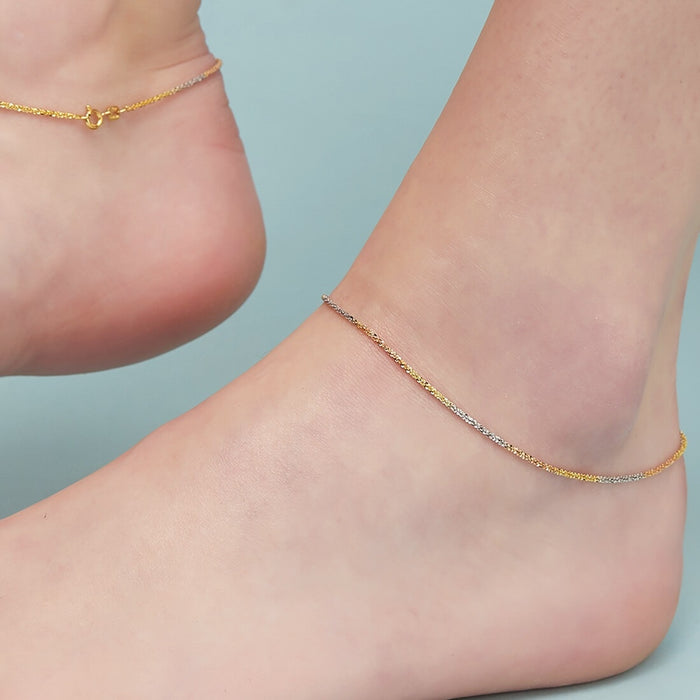 Woman's ankle wearing a triple tone weave chain 925 Sterling Silver anklet. Jewellery for women – Zavya