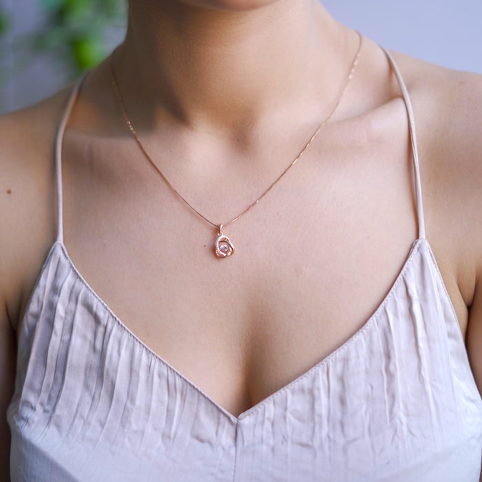 Woman wearing a rose gold 925 Sterling Silver pendant necklace. Fine jewellery for women. – Zavya