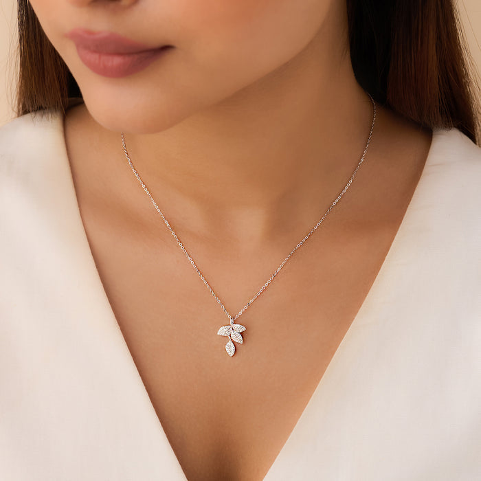 Woman wearing a delicate 925 Sterling Silver leaves pendant necklace. Jewelry for women – Zavya