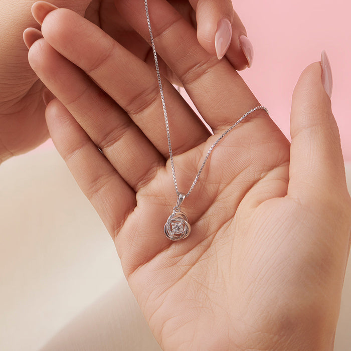 Woman's hands holding a 925 Sterling Silver pendant necklace. Elegant silver jewellery for women – Zavya