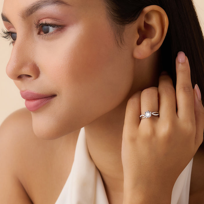 Woman wearing a 925 Sterling Silver solitaire ring with twisted band. Beautiful silver rings for women. – Zavya