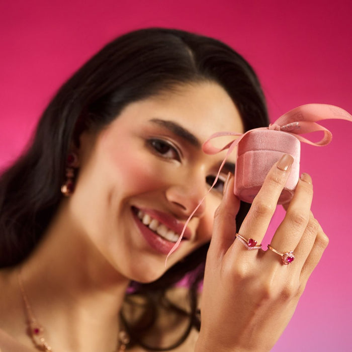 Smiling woman holding a pink box wearing a 925 Sterling Silver adjustable promise ring for women. – Zavya