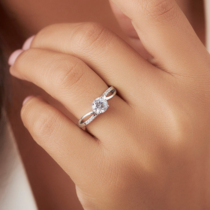Woman's hand wearing a 925 Sterling Silver twisted solitaire ring. Elegant jewellery for women – Zavya